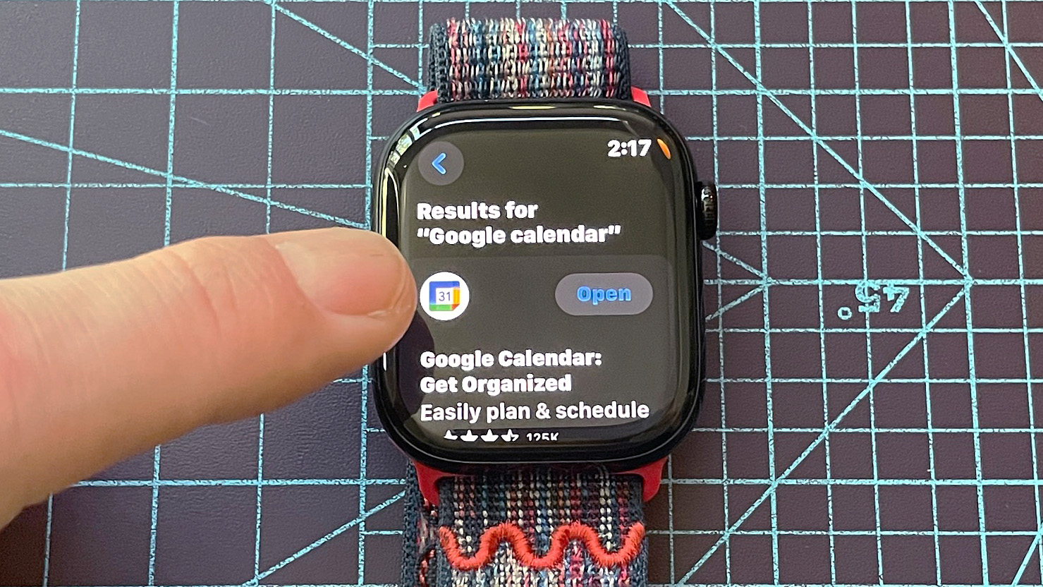 Close up of an Apple Watch Series 10 showing the steps to install the Google Calendar app, including navigating to the app store, searching and downloading the app and syncing it with your iPhone