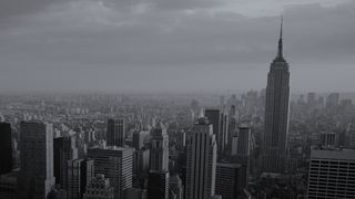 A whitepaper from IBM on enabling companies to follow a cloud service value stream and achieve desired goals, with black and white skyscraper image