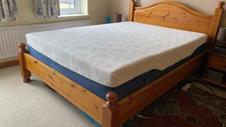 Brook + Wilde Suprema Mattress review image shows the mattress on our lead tester's wooden bed