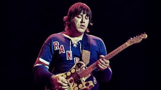 Terry Kath (1946-1978), guitarist with U.S. rock band Chicago, playing the guitar during a live concert performance at the Hammersmith Odeon in London, England, Great Britain, January 1977. 