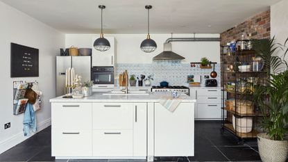 kitchen room with white wall and marble worktop with white cabinets