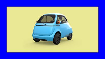 a light blue microlino