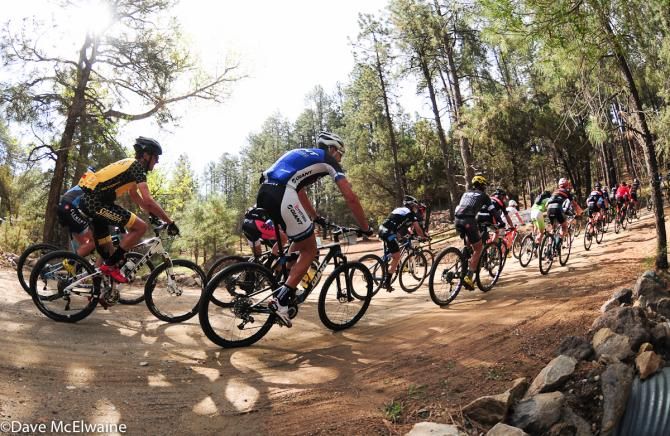Riders head onto the first fire road climb