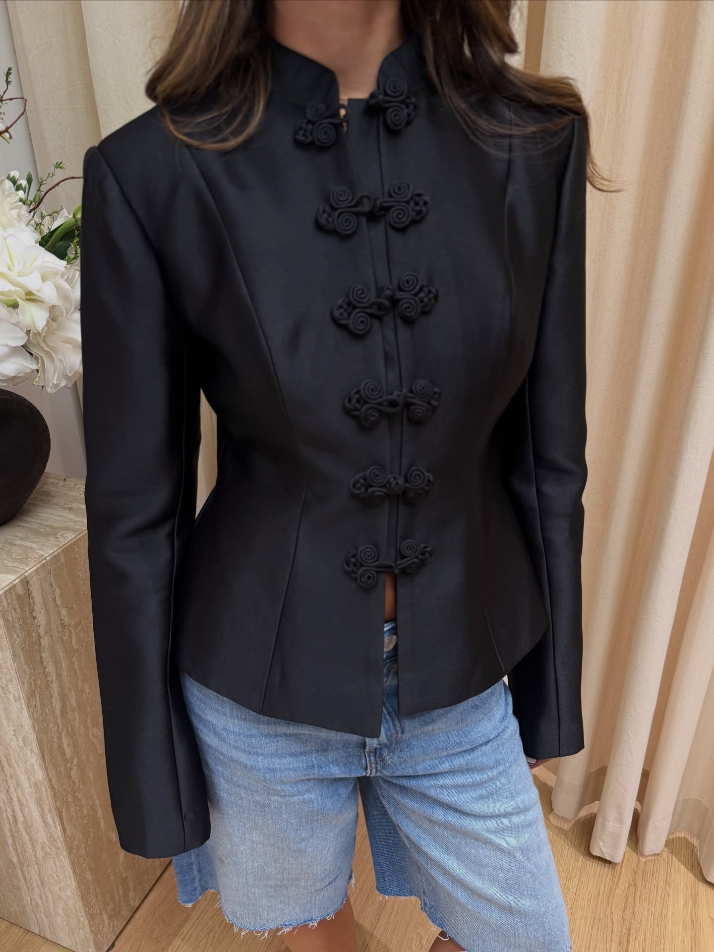 An image of @brunabear wearing a button-up jacket.