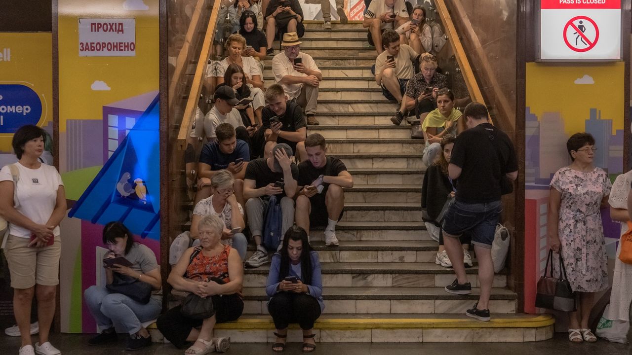 People take shelter in the Teatralna metro station during a Russian air attack, in Kyiv, on August 26, 2024, amid the Russian invasion of Ukraine. Russian drones and missiles on August 26, 2024, targeted 15 regions across Ukraine in an overnight barrage aimed mainly at energy infrastructure, Ukrainian Prime Minister Denys Shmygal said. 