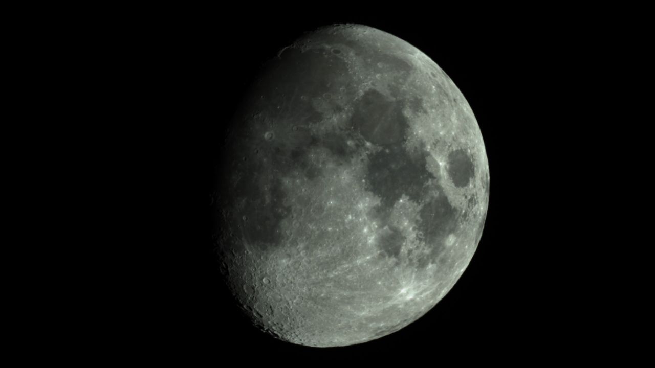 The moon against a black sky.