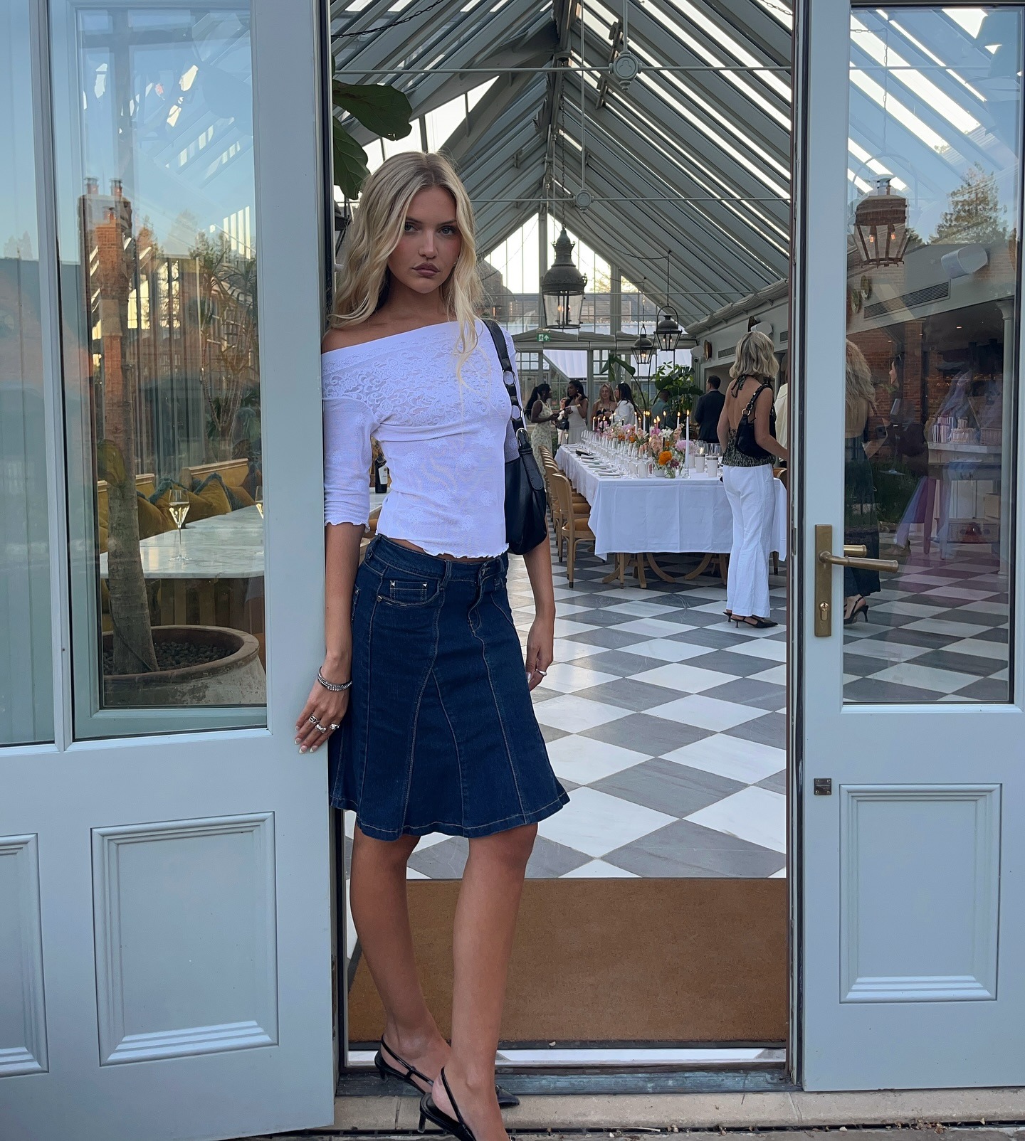 Fashion person Miaise Barker @miaisobellebarker is wearing a knee-length skirt trend. She wears a denim skirt.