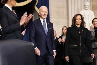 Kamala Harris and Joe Biden walk into the Capitol Building