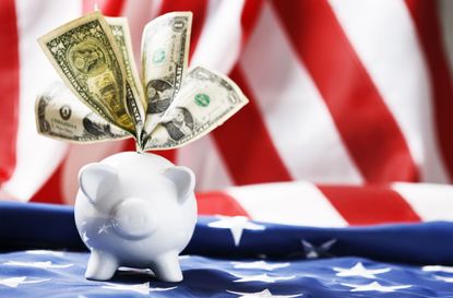 American piggy bank stuffed with dollars