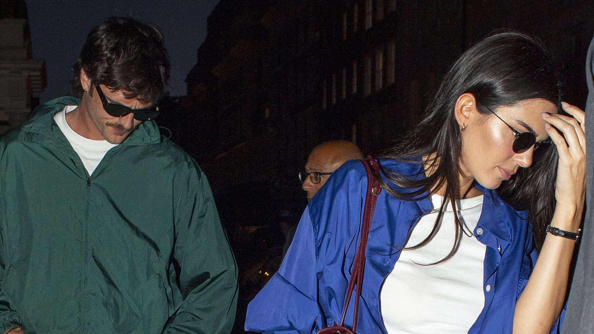 Jacob Elordi wearing a green windbreaker and Kendall Jenner wearing a cobalt blue button-down for a dinner out in London