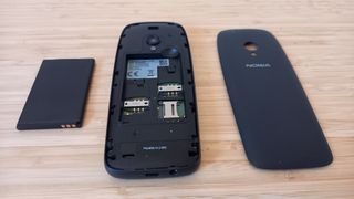 Nokia 6310 on desk with back taken off and battery removed