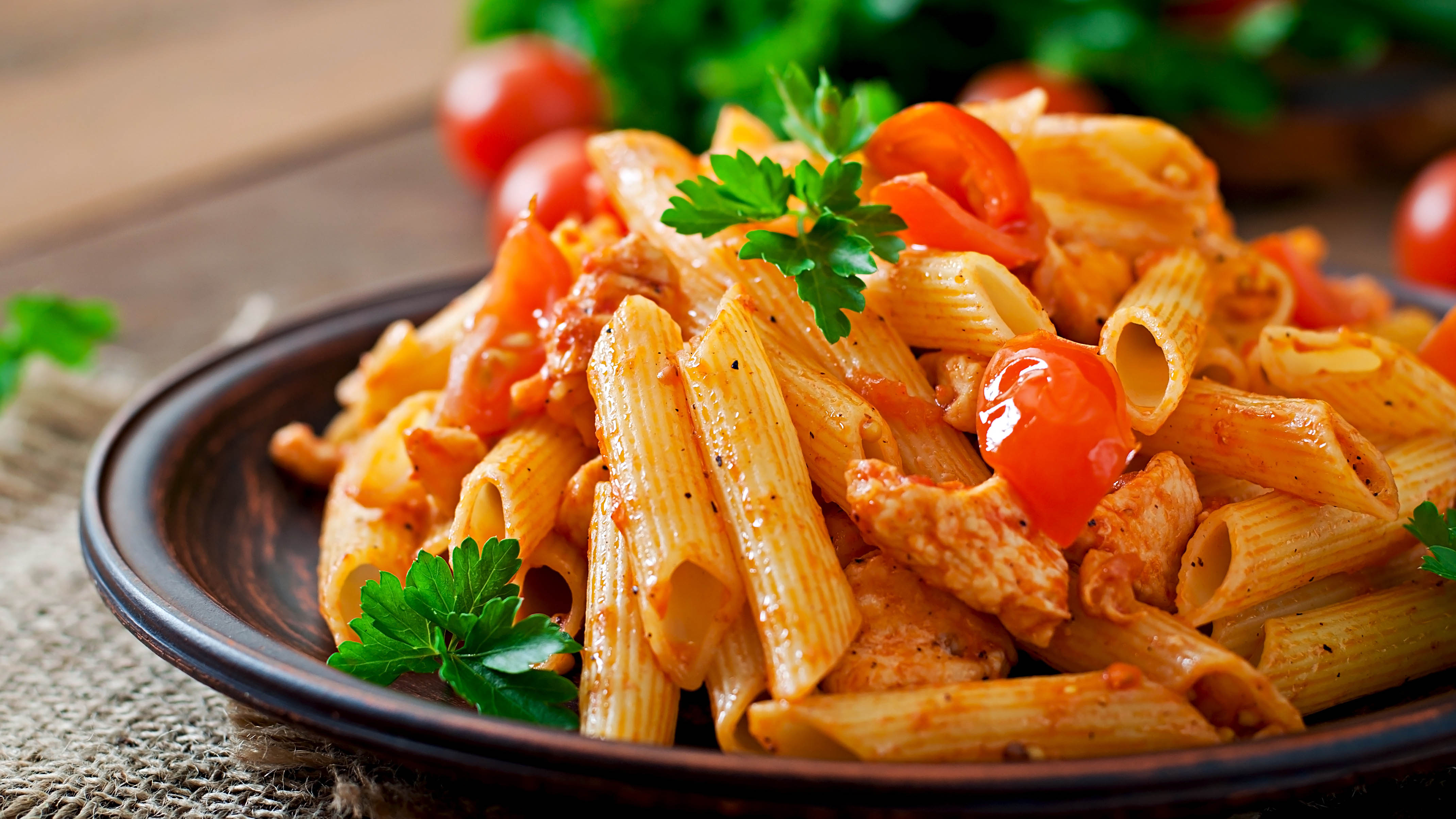 A bowl of cooked pasta with sauce