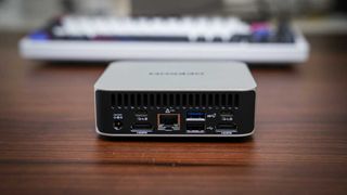 Geekom A5 Pro mini PC on a wooden desk