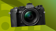 Lead image for the best travel camera buying guide, featuring the OM System OM-5