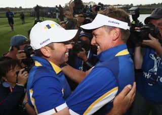 Sergio Garcia and Ian Poulter embrace at the 2018 Ryder Cup