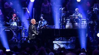Billy Joel performing on stage during Billy Joel: The 100th - Live at Madison Square Garden