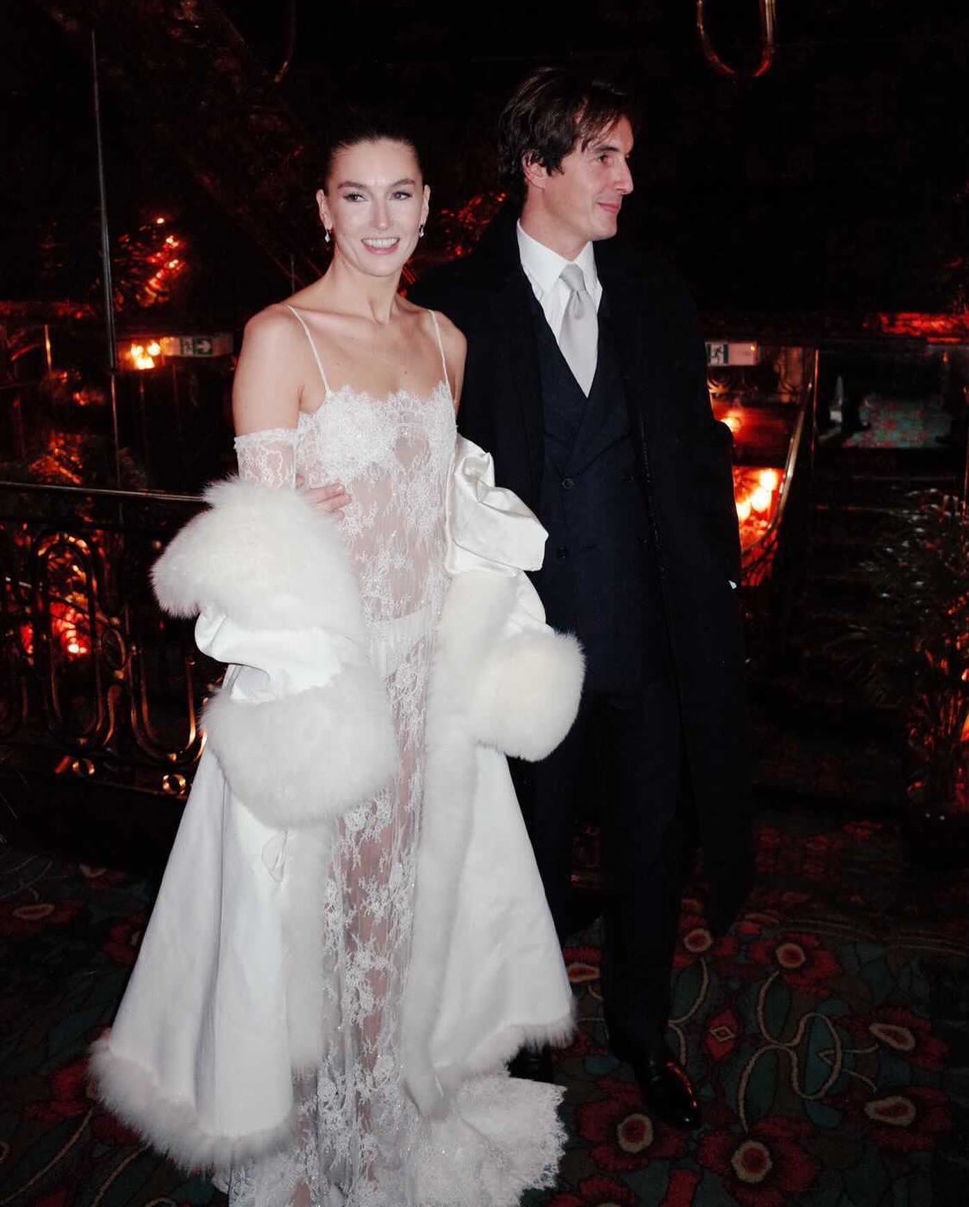 An image of @camillecharriere wearing a fur-trimmed coat, one of the biggest bridal accessories trends of 2026.