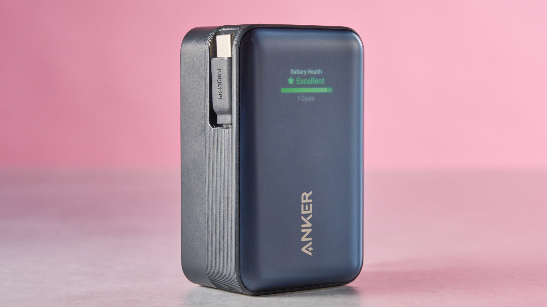 Anker Nano Power Bank 10K 45W Built-In Retractable USB-C Cable against pink background