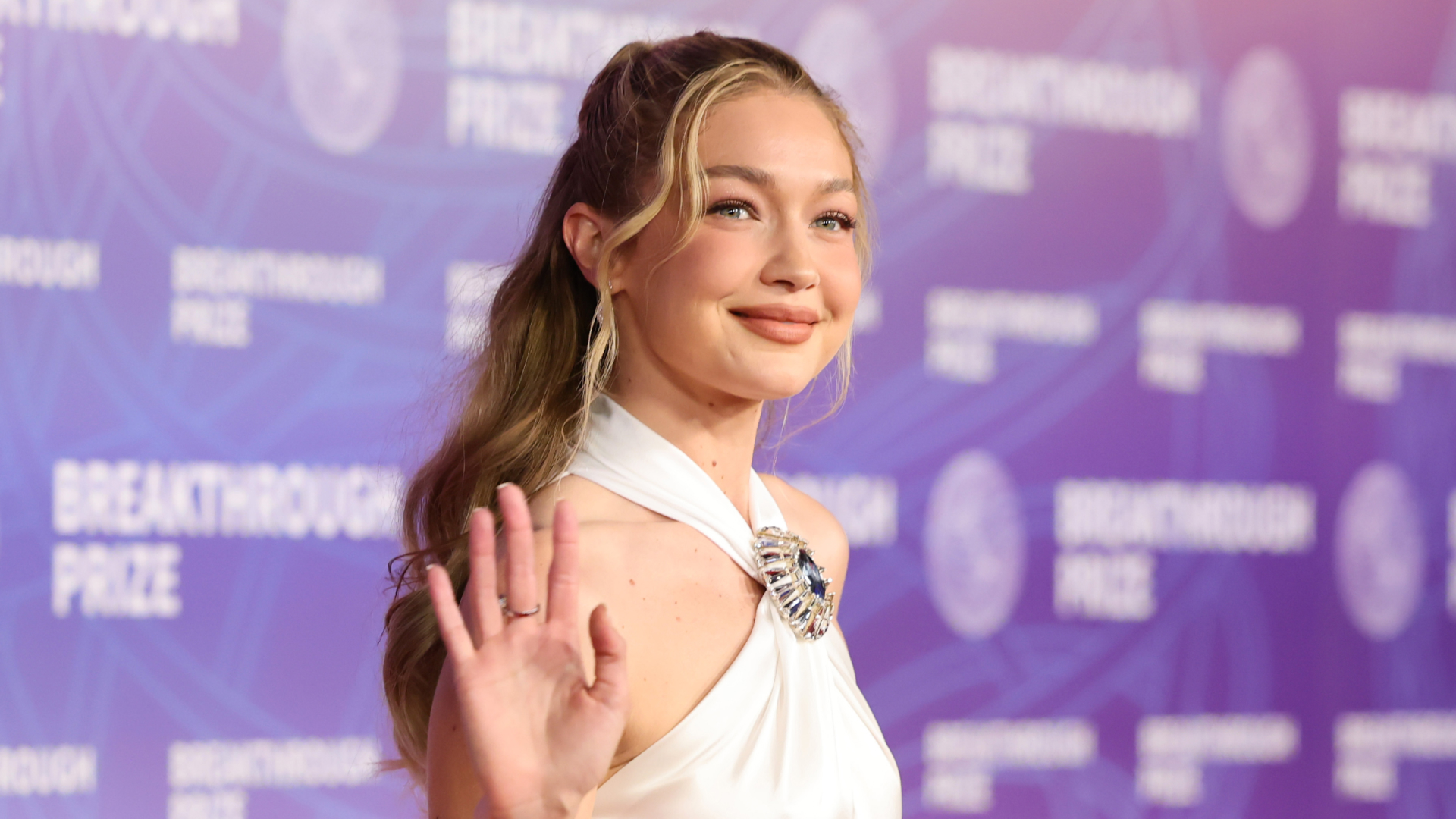 Gigi Hadid wears a bridal white nostalgic halter dress on the red carpet