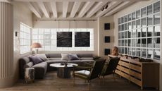 living room with beige walls and gray corner sofa, large windows and wooden floors