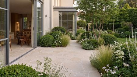 patio area with limestone tiles and plenty of planting