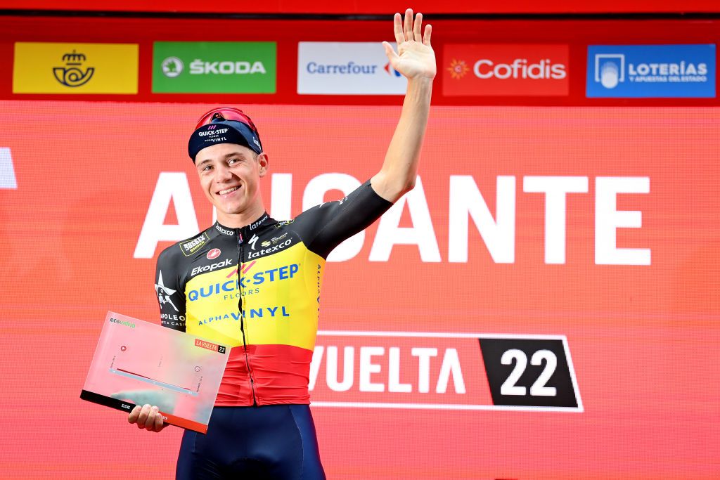 ALICANTE SPAIN AUGUST 30 Remco Evenepoel of Belgium and Team QuickStep Alpha Vinyl celebrates winning the individual time trial on the podium ceremony after the 77th Tour of Spain 2022 Stage 10 a 309km individual time trial stage from Elche to Alicante LaVuelta22 WorldTour on August 30 2022 in Alicante Spain Photo by Justin SetterfieldGetty Images