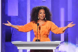 Oprah Winfrey speaks on stage at an event