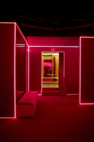 Silencio New York boasts eclectic red and golden interiors drip in neon lights