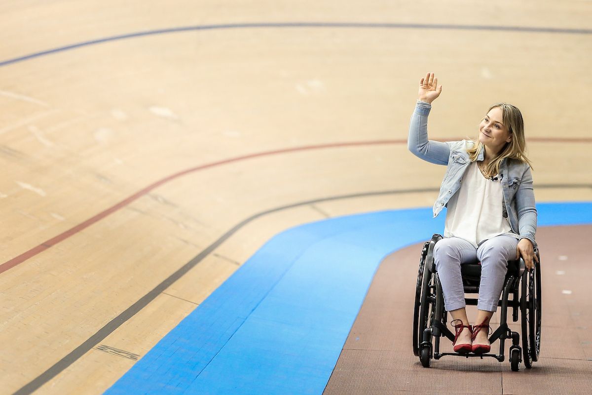 Kristina Vogel waves to her home crowd in the Berlin velodrome