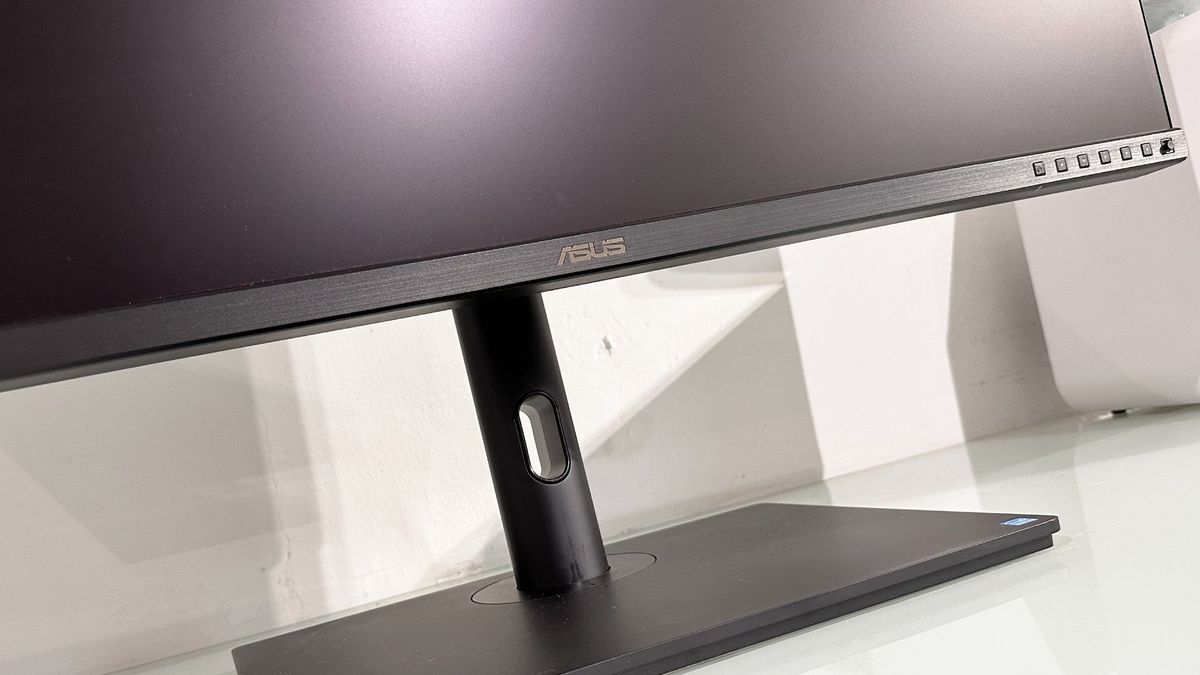 The Asus ProArt PA32KCX 8K monitor on a white desk in a home office during our review process
