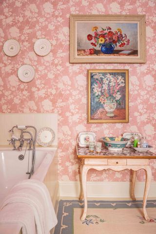 Bathroom with pink floral wallpaper by Penny Morrison