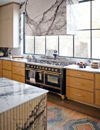 Chef's kitchen with timber cabinets and marble surface