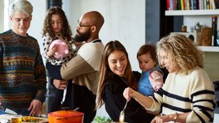 Family cooking in kitchen