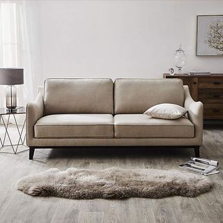 living room with cream sofa