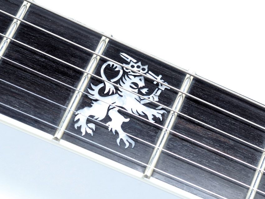 If you only have one inlay, why not make it a sword-waving knuckle duster-crowned lion?