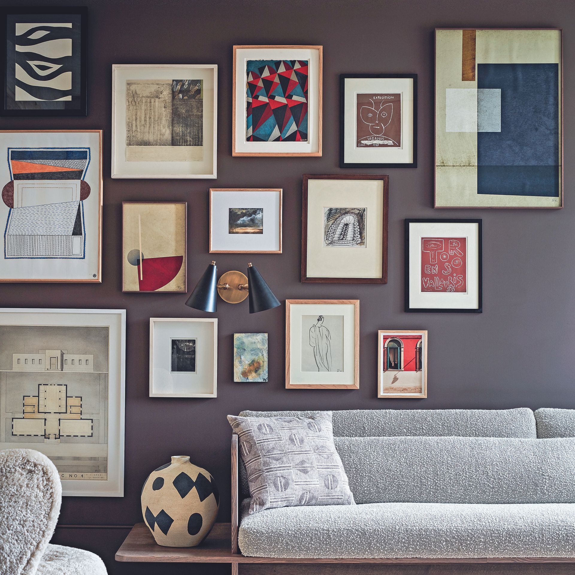 Living room with dark grey walls and gallery wall