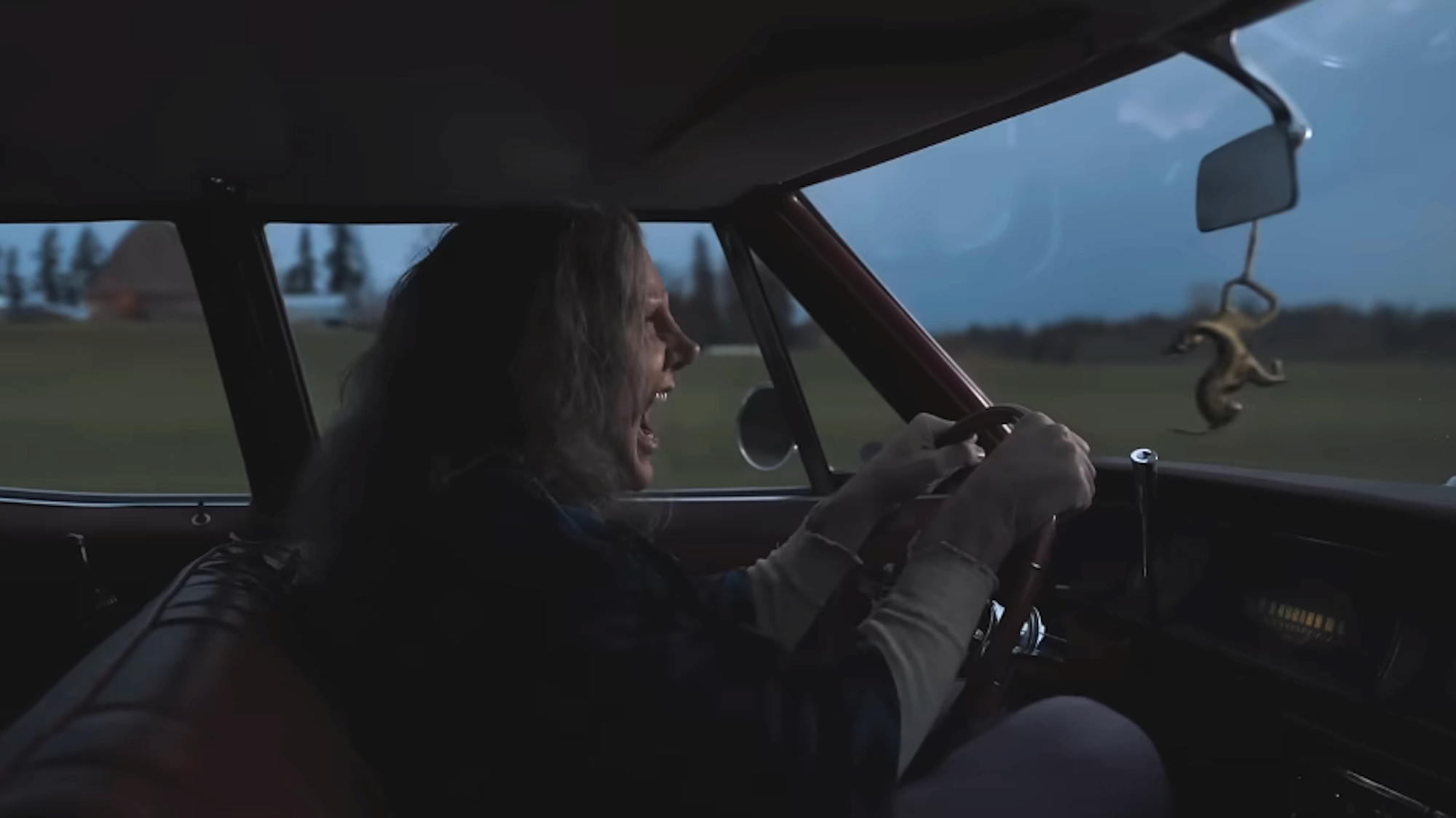 Nicolas Cage yelling in car as Longlegs