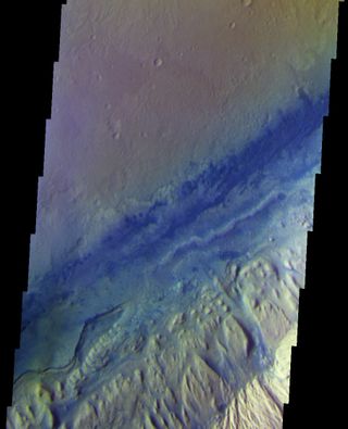 The THEMIS instrument on NASA's Odyssey orbiter images the floor of the Gale Crater, where the Curiosity rover (too small to identify) is exploring.