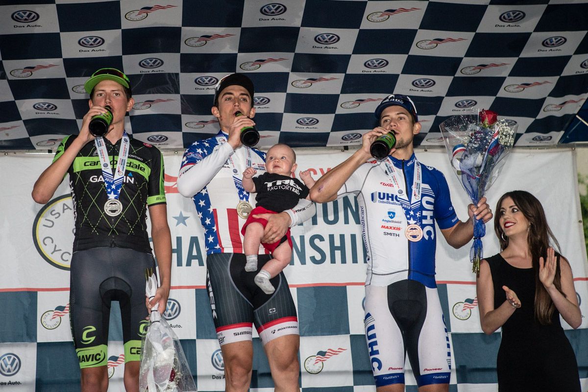 The top three for the day celebrate with a beer on the podium.