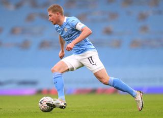 Manchester City midfielder Kevin De Bruyne dribbles with the ball