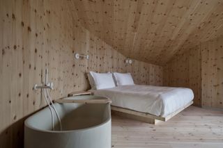 Wooden bedroom and bathtub