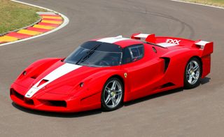 Red Ferrari car on a racetrack