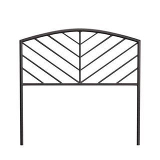 An arched black metal headboard with lines running from the left and right sides into the middle line