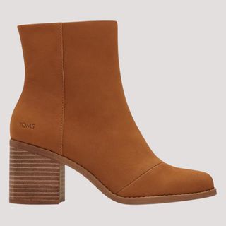 Flat lay image of tan heeled boots 