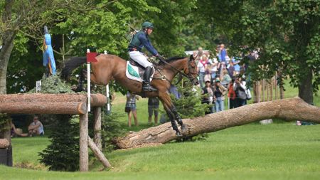 Sam Watson and Ballyneety Rocketman jump a cross-country fence at Badminton