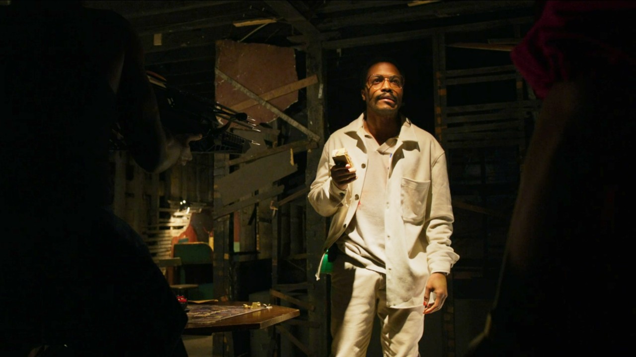Jermaine Fowler standing in The Blackening.
