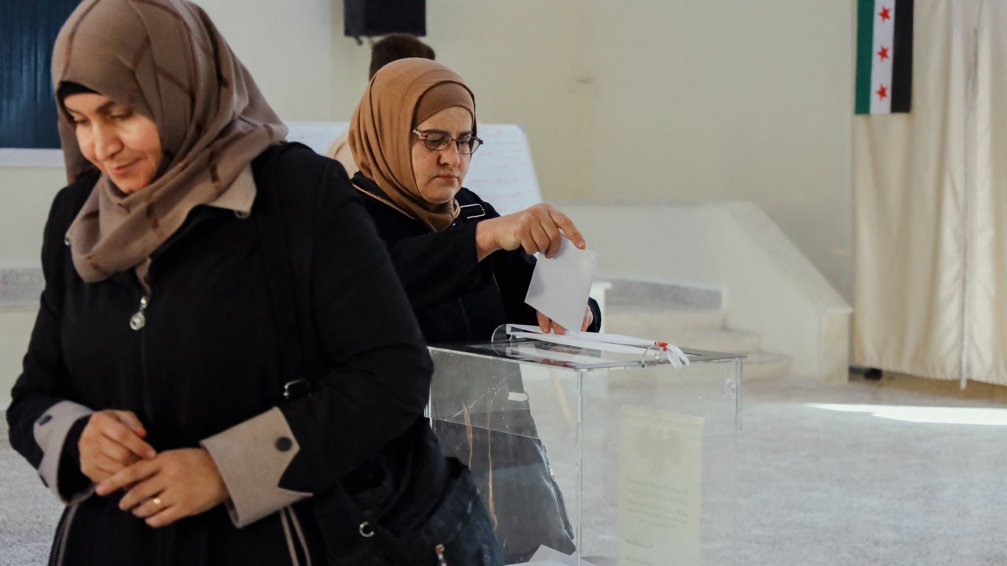 Women casting their vote at a polling station in Ariha, Idlib Governorate, Syria