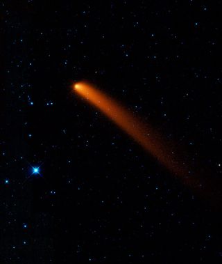 This gallery showcases the first images taken by NASA's Wide-field Infrared Survey Explorer (WISE) spacecraft. Comet Siding Spring flashes across the sky impressively in this infrared image. Observers in Australia discovered the comet, also known as C/200