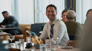 Manuel Garcia-Rulfo as Mickey Haller smiling in The Lincoln Lawyer season 3