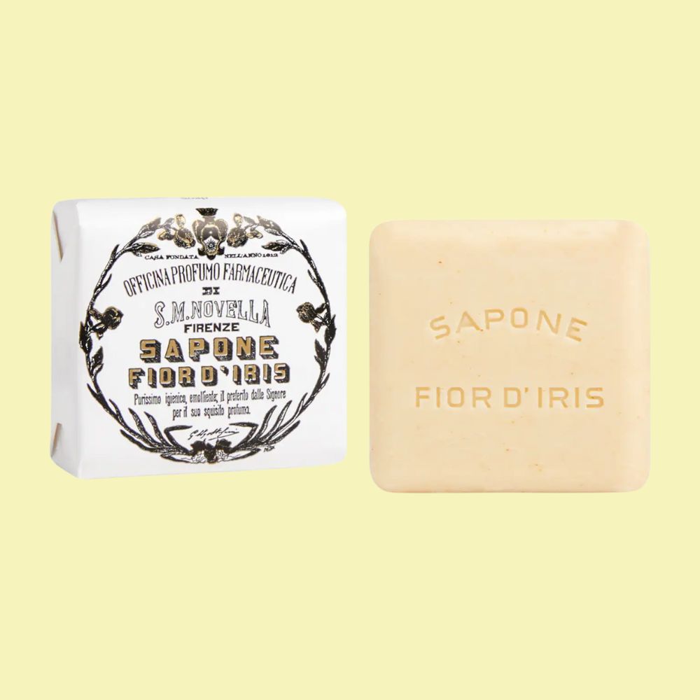 Santa Maria Novella Fior D'Iris Soap packaging and soap bar against pale yellow background.